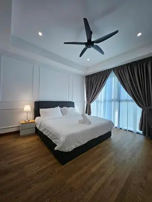 a bedroom with a bed and a ceiling fan at Alfa Bangsar by City Keys in Kuala Lumpur