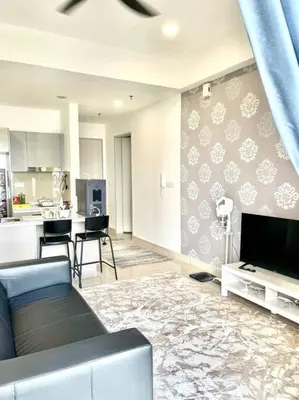 a living room with a couch and a kitchen at Trion Kuala Lumpur KLCC view L65 2br 2bth in Kuala Lumpur