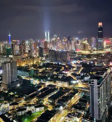 a city lit up at night with traffic at Trion Kuala Lumpur KLCC view L65 2br 2bth in Kuala Lumpur
