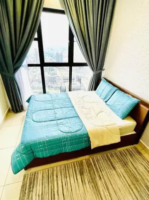 a bed in a room with a large window at Trion Kuala Lumpur KLCC view L65 2br 2bth in Kuala Lumpur