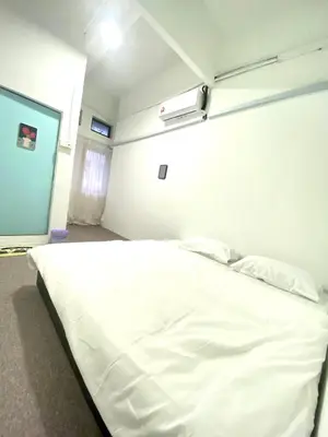 a large white bed in a hospital room at Bright Star Inn in Kuala Lumpur