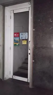 an open door with a staircase in a building at Bright Star Inn in Kuala Lumpur