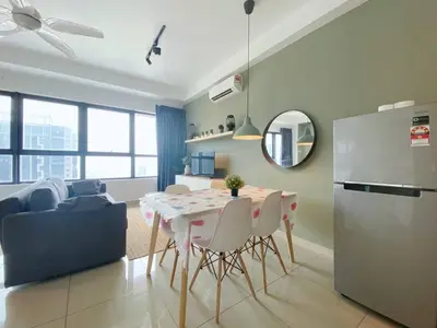 a kitchen and living room with a table and a refrigerator at Arte plus by dream stay in Kuala Lumpur