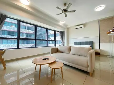 a living room with a couch and a table at Arte plus by dream stay in Kuala Lumpur