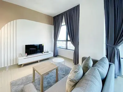 a living room with a couch and a table at Arte plus by dream stay in Kuala Lumpur
