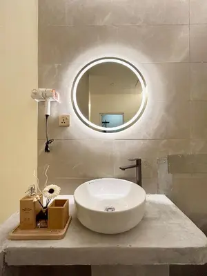 a bathroom with a white sink and a mirror at ONE18 Boutique Hotel in Kuala Lumpur