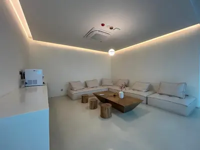 a living room with a couch and a table at ONE18 Boutique Hotel in Kuala Lumpur