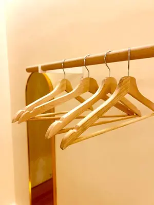 a group of wooden hangers in a room at ONE18 Boutique Hotel in Kuala Lumpur