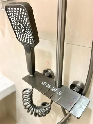 a phone hanging on a wall in a bathroom at ONE18 Boutique Hotel in Kuala Lumpur