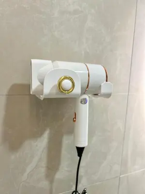 a white security camera attached to a wall at ONE18 Boutique Hotel in Kuala Lumpur