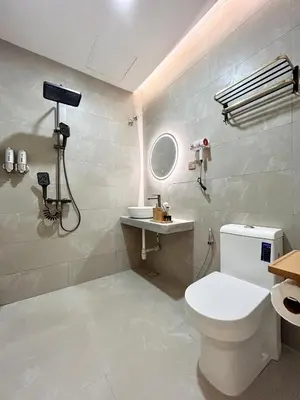 a bathroom with a white toilet and a sink at ONE18 Boutique Hotel in Kuala Lumpur