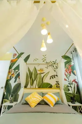 a bed with two pillows in a tent at My home at Kuala Lumpur in Kuala Lumpur