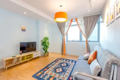 a living room with a couch and a tv at My home at Kuala Lumpur in Kuala Lumpur