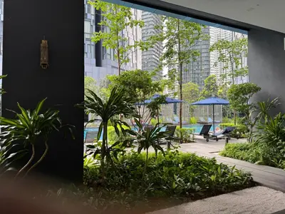 a view of a garden with plants and buildings at Cozy Comfy & Affordable Place at KLCC in Kuala Lumpur