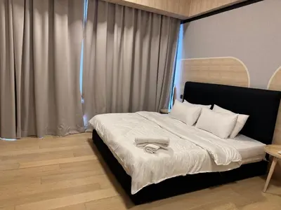 a bedroom with a bed with a towel on it at Cozy Comfy & Affordable Place at KLCC in Kuala Lumpur