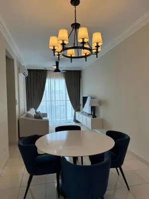 a dining room with a table and chairs at Naaa homee in Kuala Lumpur
