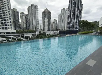 a large swimming pool in a city with tall buildings at Inspirasi at Mont Kiara by Airhost in Kuala Lumpur