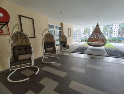 a room with three chairs in a building at Inspirasi at Mont Kiara by Airhost in Kuala Lumpur