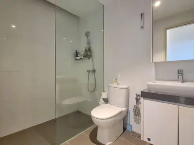 a bathroom with a toilet and a shower and a sink at SkyView Studio, EST Bangsar, High View for 2 in Kuala Lumpur