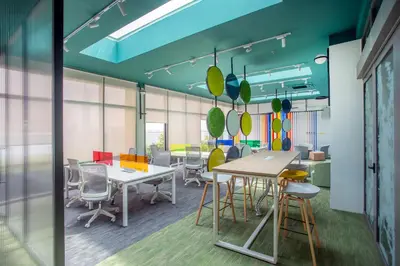 a conference room with tables and chairs in an office at Riveria City near KL Sentral with 118 view Sky Infinity Pool by COBNB in Kuala Lumpur