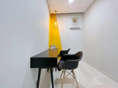 a black table and two chairs in a room at Sky Suites Central 2BR Suite KLCC View in Kuala Lumpur