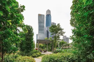 a park in the city with tall buildings at Modern Art 2BR Agile Bukit Bintang by RumaBnB in Kuala Lumpur