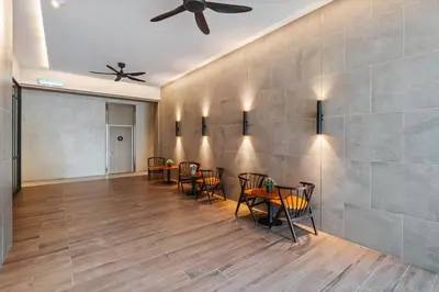 a dining room with tables and chairs and a ceiling fan at Modern Art 2BR Agile Bukit Bintang by RumaBnB in Kuala Lumpur