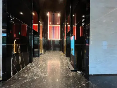 a hallway of a building with a shiny floor at Facestyle Infinity Pool KLCC Smart TV Free WiFi Two Bedroom in Kuala Lumpur
