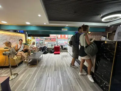 a group of people standing in a waiting room at SS Grey Hotel Bukit Bintang in Kuala Lumpur