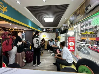 a group of people waiting for their luggage in a store at SS Grey Hotel Bukit Bintang in Kuala Lumpur