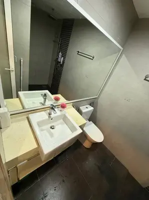 a bathroom with a sink and a toilet and a mirror at #breathtaking#zetaparkmall#klcc#Honeymoon#2p#118 in Kuala Lumpur