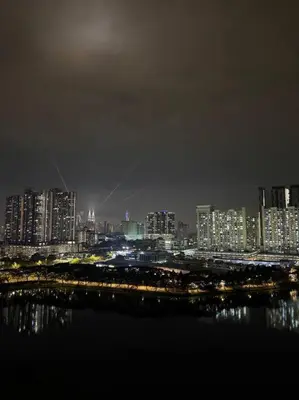 a view of a city at night with the water at #breathtaking#zetaparkmall#klcc#Honeymoon#2p#118 in Kuala Lumpur