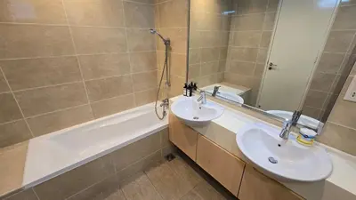 a bathroom with a sink and a mirror and a tub at Bintang Goldhill Near TRX & Pavilion Mall,MRT,KL By Proplet in Kuala Lumpur