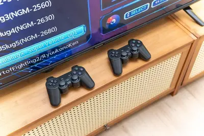a group of video game remotes sitting on a table at Relaxing Muji Retreat with Jacuzzi, Retro Games, MRT in Kuala Lumpur