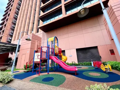 a playground with a slide in front of a building at Times Square by Manhattan Group in Kuala Lumpur