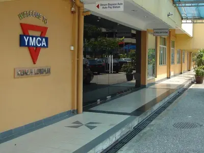 a store front with a sign on the side of a building at YMCA Kuala Lumpur in Kuala Lumpur