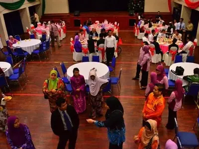 a group of people standing in a banquet hall at YMCA Kuala Lumpur in Kuala Lumpur