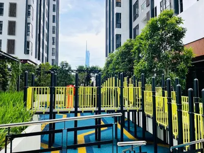 a playground with yellow fences in a city at Sentral Suites By Eassy Hotel in Kuala Lumpur