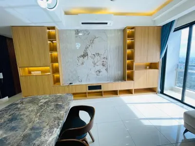 a room with a table and chairs and a map on the wall at Sentral Suites By Eassy Hotel in Kuala Lumpur