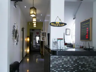 a restaurant with a sign hanging above a counter at OYO 101 V'la Heritage Hotel in Kuala Lumpur