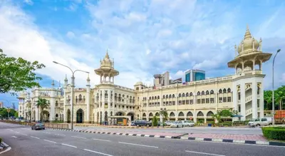 a large white building with two towers on a street at ZEN Rooms Metro Hotel @ KL Sentral in Kuala Lumpur