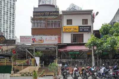 a group of motorcycles parked in front of a building at OYO 90106 Sindbad Hotel in Kuala Lumpur