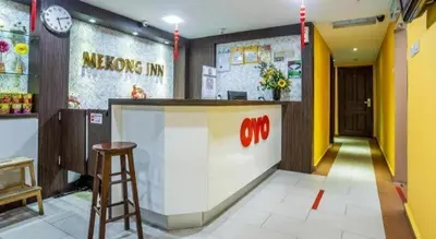 a restaurant with a counter and a stool in a room at OYO 90173 Hotel Mekong in Kuala Lumpur