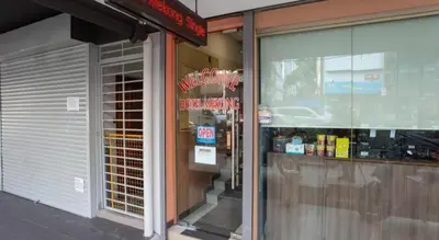 a store front of a store with a sign in the window at OYO 90173 Hotel Mekong in Kuala Lumpur