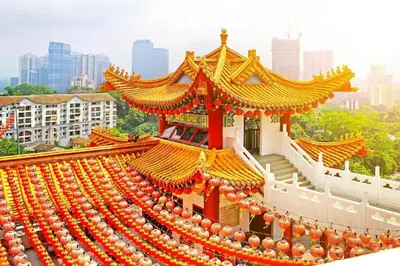 a chinese building with red and orange decorations on it at Capital O 90788 New Hotel 33 Permaisuri in Kuala Lumpur