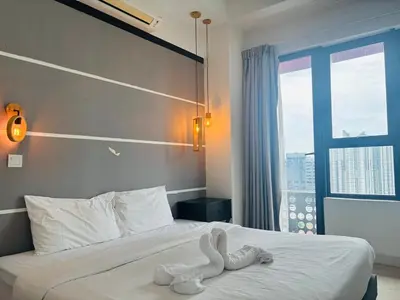 a hotel room with a bed with a towel on it at Arte Plus by Willow Trip in Ampang