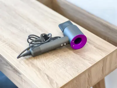 a tool sitting on top of a wooden table at The Luxe by Manhattan Group in Kuala Lumpur