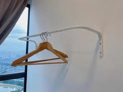 a wooden hanger in front of a window at Arte Plus by Manhattan Group in Kuala Lumpur