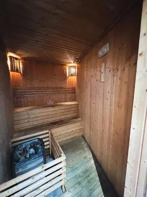 an empty sauna with wooden walls and wooden floors at V Residence Sunway Velocity Kuala Lumpur by Vivid Stay in Kuala Lumpur
