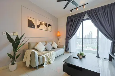 a living room with a couch and a large window at V Residence Sunway Velocity Kuala Lumpur by Vivid Stay in Kuala Lumpur